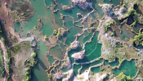 Aerial-view-Turquoise-lake-at-Guar-Petai-also-called-Jiuzaigou-of-Malaysia"."